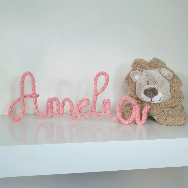 crochet wire letters on a shelf